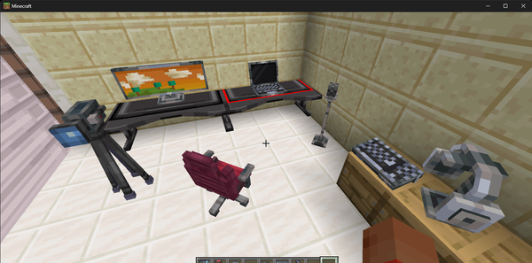 デスク、モニター、キーボード、ノートPC、ヘッドホン、テレビカメラ、マイク